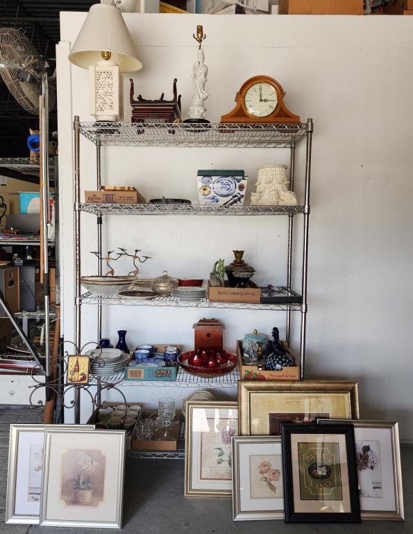 Cart Full of Miscellaneous Items and Artwork: Cart full of misc. household/decor items. - Table lamps, clocks, framed pictures, blue and white dinnerware, large metal decorator bowl, marble turtle cutting board, metal wall wine rack, and more! Ca