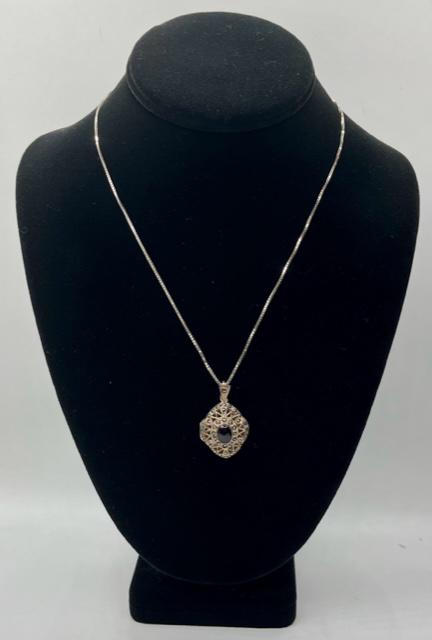 Sterling Box Chain with Locket Pendant: Sterling box chain with locket pendant. - 18" Chain marked Italy 925. - Sterling marcasite and onyx? locket marked 925. Approx. 1 1/4". Photos are considered part of the description and condition. 905