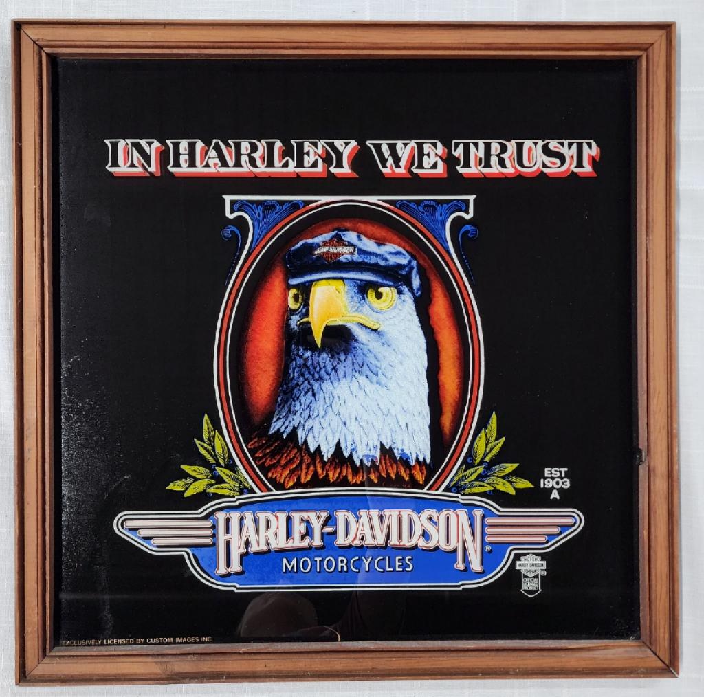 Harley Davidson Motorcycles Advertising Sign: Harley Davidson motorcycles advertising sign. - "In Harley We Trust" - reverse image printed on glass. - approx. 22"H X 22"W. Photos are considered part of description and condition. O