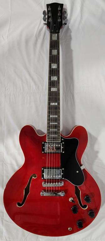 Semi-Hollow Electric Guitar: Semi-Hollow Electric Guitar with Mother of Pearl Inlay on Neck. Red. Approx. 43"H. Photos are considered part of the description and condition.