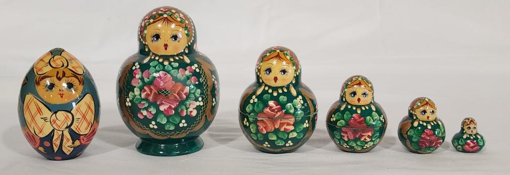 Hand Painted Russian Matryoshka Doll and Egg: Hand Painted Russian Matryoshka Doll and Egg. Set of 5 Wood Nesting Dolls. Tallest 4"H. 1 has a crack. Egg. Approx. 3"H. Photos are considered part of the description and condition.