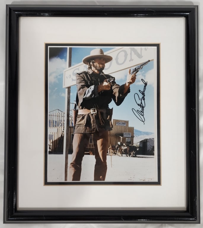 Signed and Framed Clint Eastwood Picture w/ COA: Signed and Framed Clint Eastwood Picture with Certificate of Authenticity. Approx. 15.5"H x 13.5"L. Berner's does not guarantee authenticity of signature or COA. Photos Are Considered Part Of The Desc