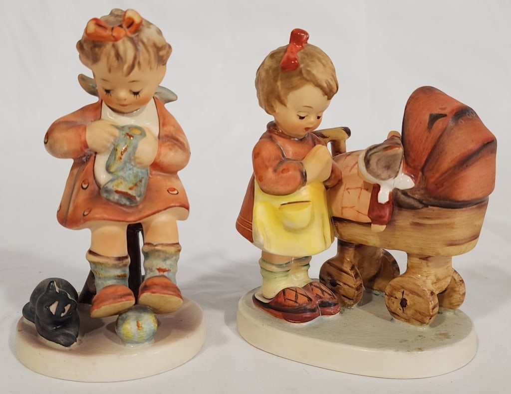 Pair of Hummel Porcelain Figurines: Pair of Hummel Porcelain Figurines. *Mother's Helper. Approx. 4.5"H. *Doll Mother. Approx. 4.5"H. Photos are considered part of the description and condition.