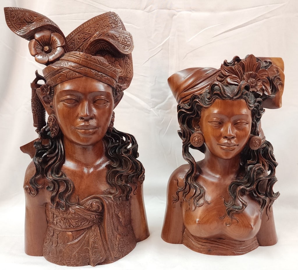 2 Signed Hand Carved Indonesian Teak Busts: 2 Signed Hand Carved Indonesian Teak Busts - Nude bust Approx. 12"H x 8"W. Strand of hair broken. - Taller bust approx. 14.5"H x 8"W. Sword handle has been reattached. Both signed on bottom. Photos ar