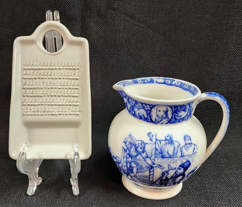Wedgwood Porcelain Pitcher and Porcelain Grater: Wedgwood Porcelain Pitcher and Porcelain Grater. Wedgwood Ivanhoe pitcher approx. 5"H. Porcelain grater approx. 6"L. Photos are considered part of the description and condition.