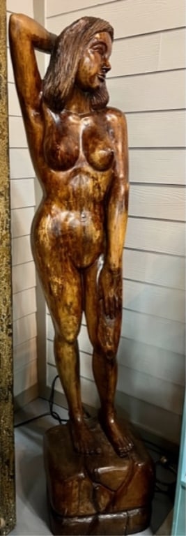 74" Carved Wood Woman Statue: Carved wood nude woman statue. Gloss finish. Nude woman standing on square base. All one piece. Approx. 74"H x 16"W. Photos are considered part of the description and condition. R