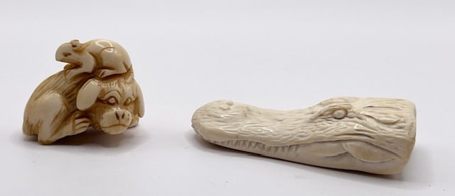 Carved Bone Alligator and Asian Monkey Netsuke: Carved bone alligator head and Asian monkey netsuke. Alligator head approx. 2.25"L. Marked Dietz on underside. Monkey approx. 1.25"L. Signed on foot. In presentation boxes. Photos are considered part 