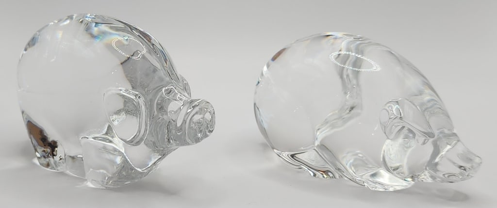 Steuben and Tyko Signed Glass Pigs: 2 Signed glass pigs. - Steuben crystal 3" pig. -Tyko signed crystal pig. 3". Photos are considered part of the description and condition.