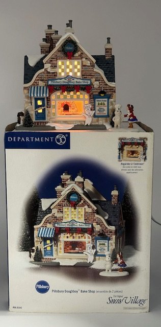 Dept 56 "Pilsbury Dough Boy Bake Shop" Snow Village Store: Dept 56 "Pilsbury Dough Boy Bake Shop" snow village piece.With original box. Dough boy has been repaired at ankles.Photos are considered part of the description and condition.