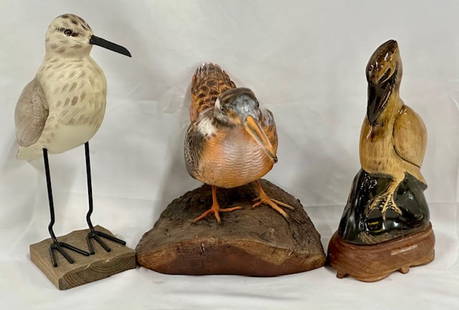3 Carved Wood Birds: 3 Carved Wood Birds. *Wood Sanderling with Metal Legs on a base. Approx. 10.5"H x 3" W x 3"D. *Hand Carved Pelican. Approx. 9.25"H.". *Hand Carved American Woodcock on Log. Approx. 7" x Photos are con