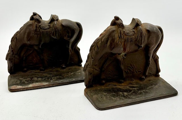 Vintage Bennett Cast Iron Grazing Horses Bookends: Vintage Cast Iron Grazing Horses Bookends. Stamped Bennett. Approx. 4.5"H x 5.25"W x 2"D. One missing felt on bottom. Photos Are Considered Part Of The Description and Condition.