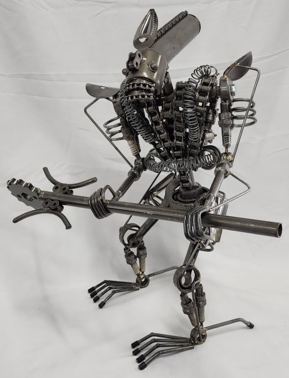 16" Metal Art Alien Sculpture: Large metal art alien sculpture. Made from Nuts, bolts, spark plugs, chains and other metal parts. Approx. 16.5"H. Head and body rotates. Photos are considered part of the description and condition.