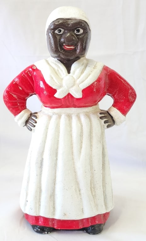 Black Americana Cast Iron Aunt Jemima Coin Bank: Black Americana Cast Iron Aunt Jemima Coin Bank. Possible reproduction. Approx. 10.5"H. Photos Are Considered Part Of The Description and Condition.