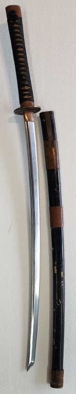 Vintage Japanese Style Katana Sword: Vintage Japanese style katana sword with tsuba (handguard) featuring a nude geisha motif. Features scabbard that houses a kozuka (small utility dagger). Approx. 42.5" Length. Please ask any questions