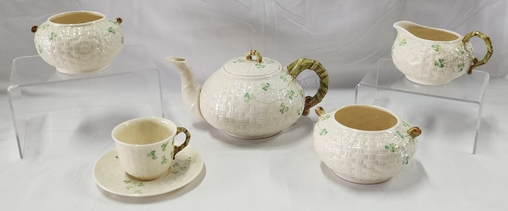 Collection of Vintage Belleek Shamrock Basketweave: Collection of Vintage Belleek Shamrock Basketweave. Fine Bone China Coffee Pot, Creamer and 2 Sugar Bowls, Cup & Saucer. Sizes vary. Photos Are Considered Part Of The Description And Condition. 208.