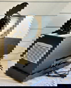 Da-Lite Vu-Lyte IV Projector: Da-Lite Vu-Lyte IV model no. 12400 110V projector. Place photograph on tray and project onto wall. Adjustable tray and lens. In working condition. Sticker on front reads "Property of Brevard