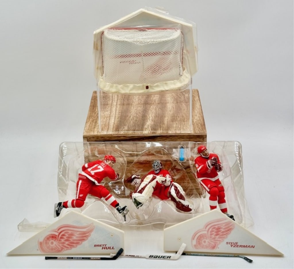 McFarlane Detroit Red Wings Action Figures: Pack of (3) action figures by McFarlane's Sports Picks featuring Detroit Red Wings ice hockey team players in official red jerseys: Yzerman, Joseph, and Hull. Box has been previously opened. Goalie's