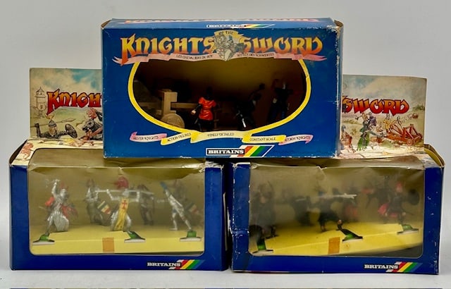 3 Boxes of Britains Knights of the Sword: Collection includes #7786 Ballista with 4 Storm Knights, #7740 7 Silver Knights, & #7741 7 Storm Knights. All boxes in aged condition with imperfection. Photos Are Considered Part Of The Condition And