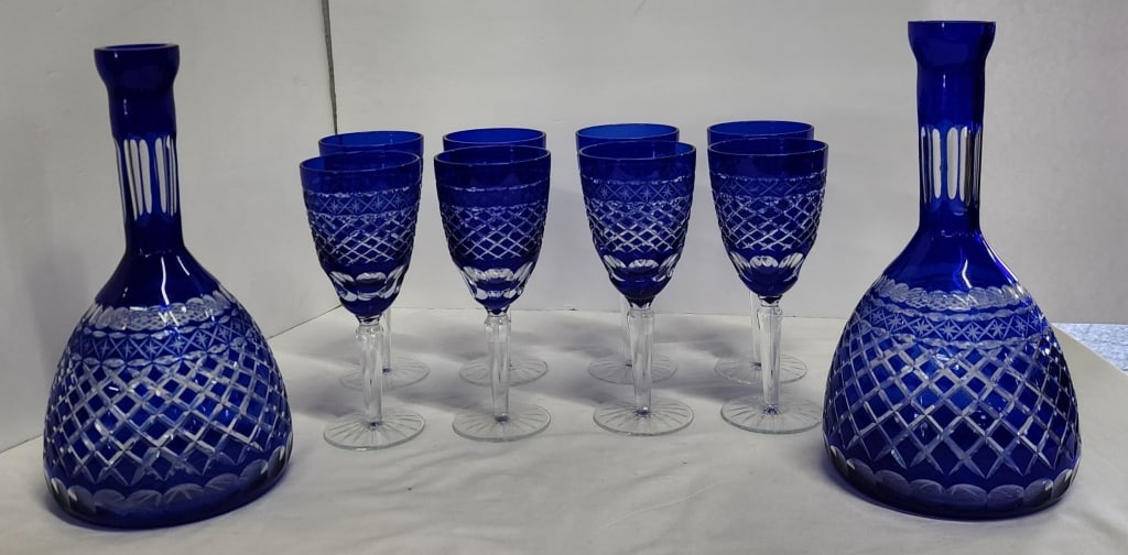 Vintage Gorgeous Sorelle Blue Cut To Clear: Vintage Gorgeous Sorelle Crystal Cobalt Blue Cut To Clear decanters and glasses. Pair of decanters missing stoppers. (8) wine glasses. Photos are considered part of the condition and description.