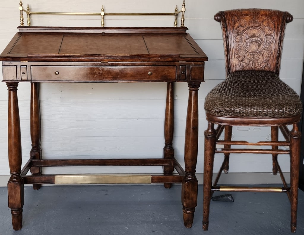Thomasville Hemingway Collection Slant Front Desk: Nice Thomasville Ernest Hemingway Collection slant front high top writing desk with matching chair. Desk has brass gallery with leather style panels all around and inside. Approx. 45" w x 26" d x 46"