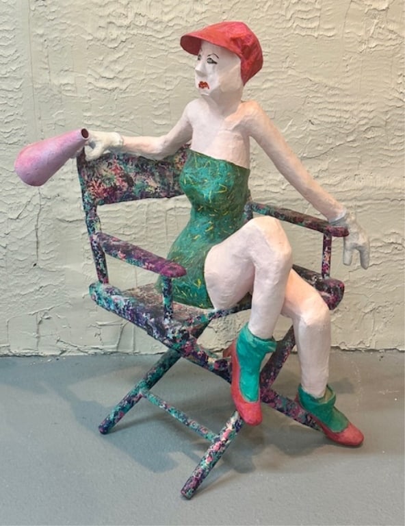 Handmade Practical Art Sculpture: Paper machete and plaster? hand made practical art sculpture, female in director's chair with megaphone. Approximately 46"h x 28"w x 27"d. Photos are considered part of the condition and description.