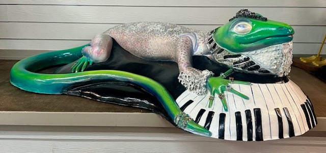 Artist Signed Large Art Deco Iguana on Keyboard: Large art deco plaster/paper machete? iguana on keyboard. Decorated with stars and jewelry. Artist signed, Bonnie Sprung 2002. Approximately 22"h x 36"w x 80"l. Photos are considered part of the condi