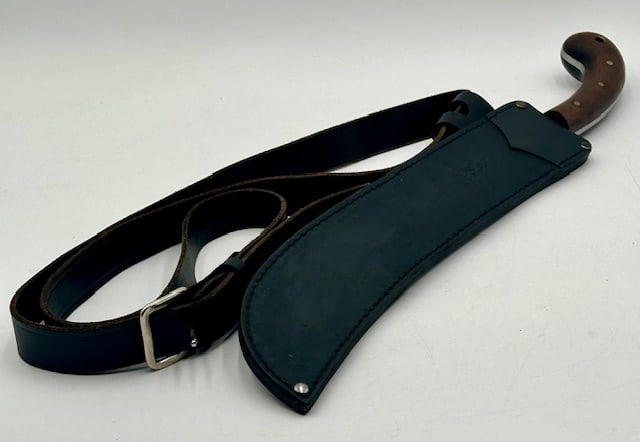 Condor El Salvador Machete w. Belt: Condor El Salvador wood handle machete with leather sheath and belt. Belt marked 62. 22" long , blade 14". Photos are considered part of the condition and description. 404-35