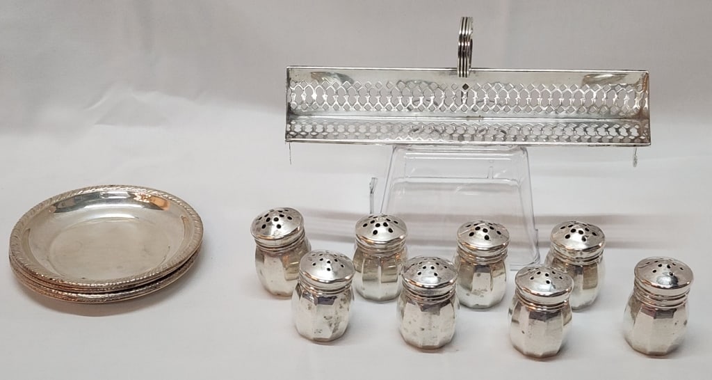Assorted Sterling Table Accessories - 4.7oz: Assorted sterling table accessories. 4.7oz combined weight. 8 (4 Sets) Sterling salt and pepper shakers. approx. 1.5"H. 1.935oz combined. Sugar cube rack approx. 6"L. 1.185oz. Set of 4 sterling nut di