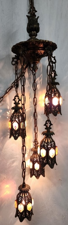 Vintage Hollywood Regency Hanging Swag Lamp: Vintage 5 tiered Hollywood Regency swag lamp. Featuring gilded brass, Lucite jewels, & tulip lily filigree. Approximately 38"h. Photos are considered part of the condition and description. 804-49