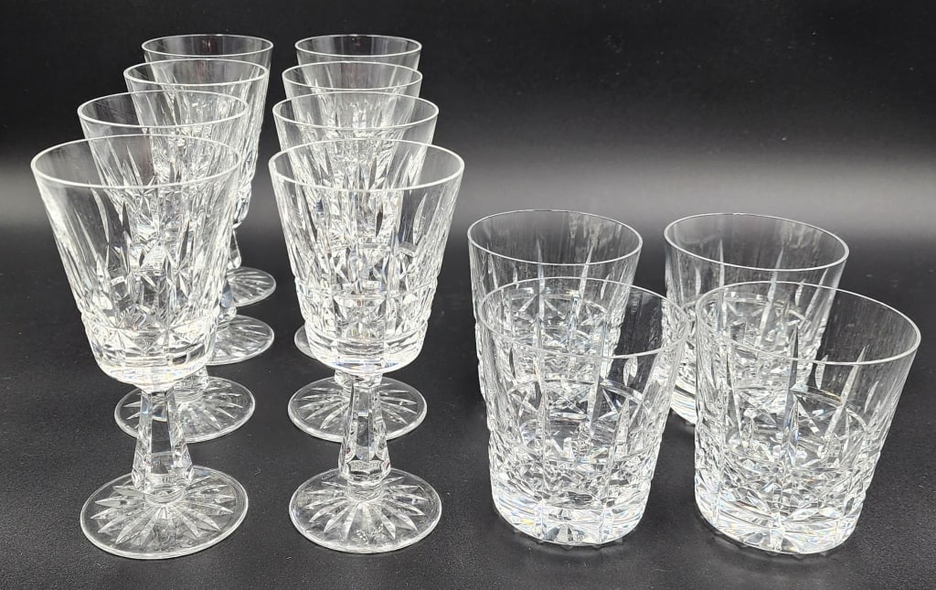 Collection of Waterford Crystal Drinkware: Collection of Waterford crystal drinkware. Includes (4) Kylemore old fashion glasses, approximately 3.5"h and (8) Rosslare wine glasses, approximately 6"h. Small chip in one wine glass. Photos are con