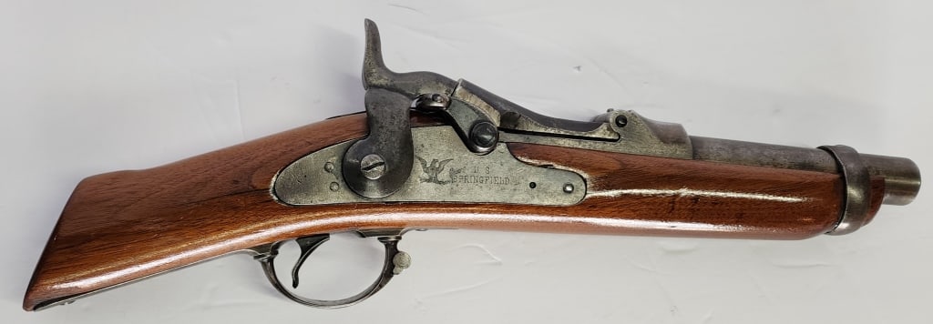 U.S. Springfield Model 1884 Trapdoor Rifle: U.S. Springfield model 1884 trapdoor rifle. Serial # 481757. Appears to have had both sides sawed off. Eagle head P making. Approximately 17" long. Photos are considered part of the condition and desc
