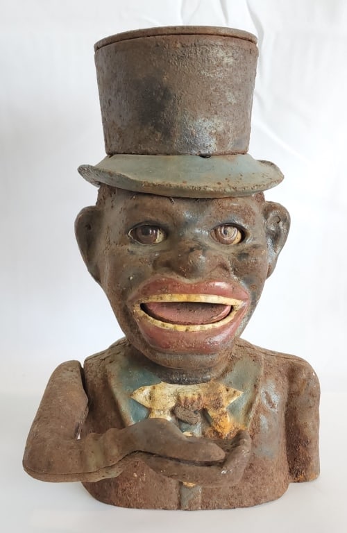 Vintage Jolly Roger Cast Iron Coin Bank: Vintage Jolly Roger top hat cast iron coin bank. In aged condition. Approximately 8.5"h. Photos are considered part of the condition and description. R