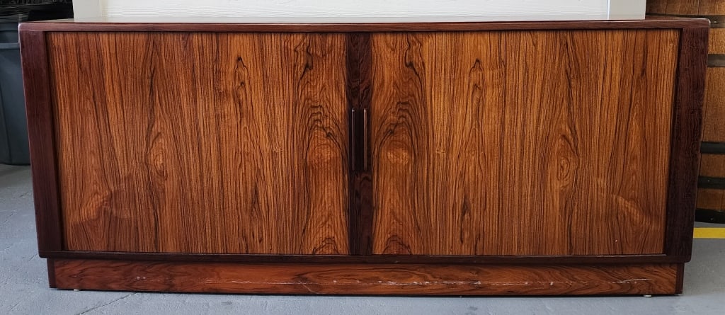 Danish Rosewood Tambar Credenza: Danish rosewood Tambar credenza. Made in Denmark. Internal side shelves and 4 pull out drawers. Approximately 30"h x 71"w x 20.5"d. Photos are considered part of the condition and description. 603
