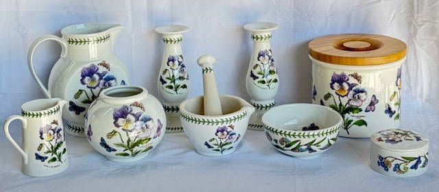 9 Piece Portmeirion Botanic Garden Pansy Collection: 9pc Portmeirion Botanic Garden collection. Featuring Viola Hybrida; Pansy flower. Set includes; (1) 8" pitcher, (1) 4.5" creamer, (2) 7.5" candlestick holders, (1) 6.5" canister, (1) 5" vase, (1)