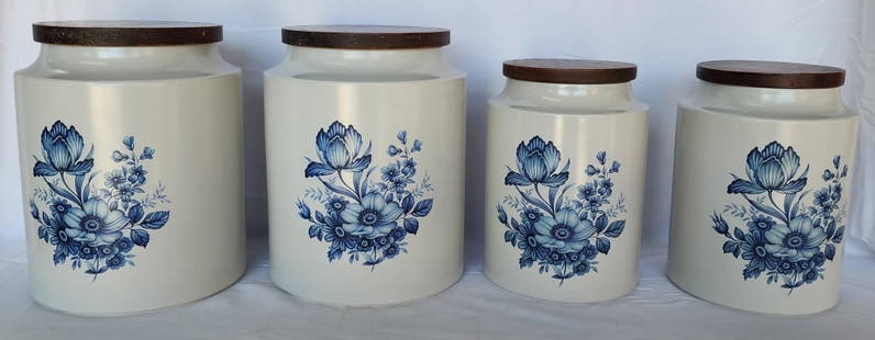 Set of 4 Hyalyn Pottery Ceramic Canisters w. Lids: Set of 4 Hyalyn USA Pottery ceramic canisters with wooden lids. Blue flowers pattern. Includes (2) #925 8" canisters and (2) #926 9" canisters. Photos are considered part of the condition and