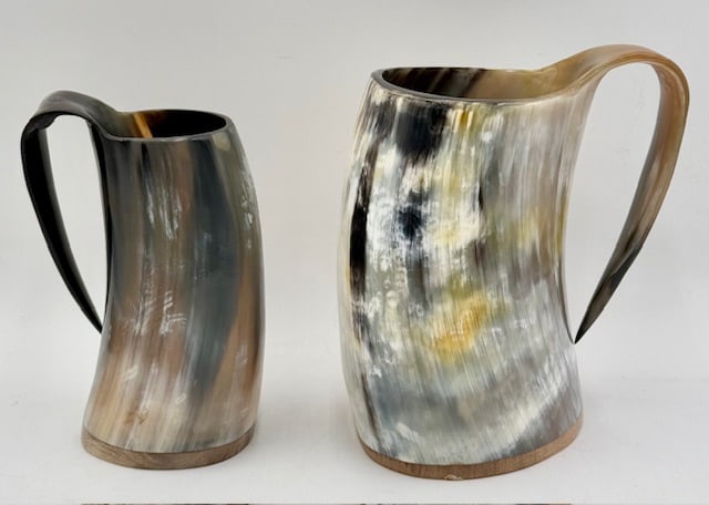 Pair of Viking Drinking Horn Mugs: Pair of Viking drinking horn mugs. Approximately 8.25" & 7". Photos are considered part of the condition and description.Y