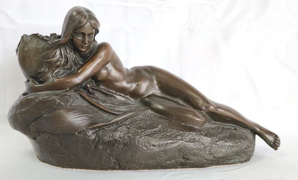 Signed Milo Reclining Nude Bronze Sculpture: Signed Milo art nouveau reclining nude bronze sculpture. Opening for possible candle stick? Approximately 7"h x 12"w x 5"d. Photos are considered part of the condition and description. 606-1
