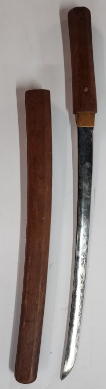 Japanese Tonto Katana Wakizashi Sword: Japanese Tonto Katana Wakizashi sword. Wood handle and sheath. Crack present in handle. In aged condition. Approximately 25"l. Photos are considered part of the condition and description. 306-18