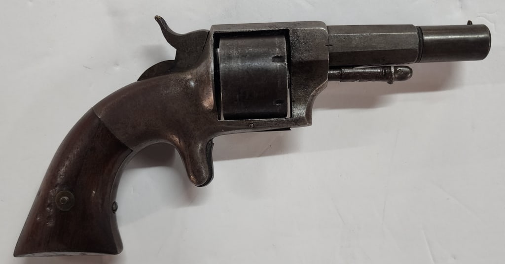 Antique .32 Rimfire Hopkins & Allen Revolver: Antique .32 Rimfire Revolver. Made by Hopkins & Allen Mfg. Co., Norwich, CT. Approximately 7.5"l. Photos are considered part of the condition and description. 306-13
