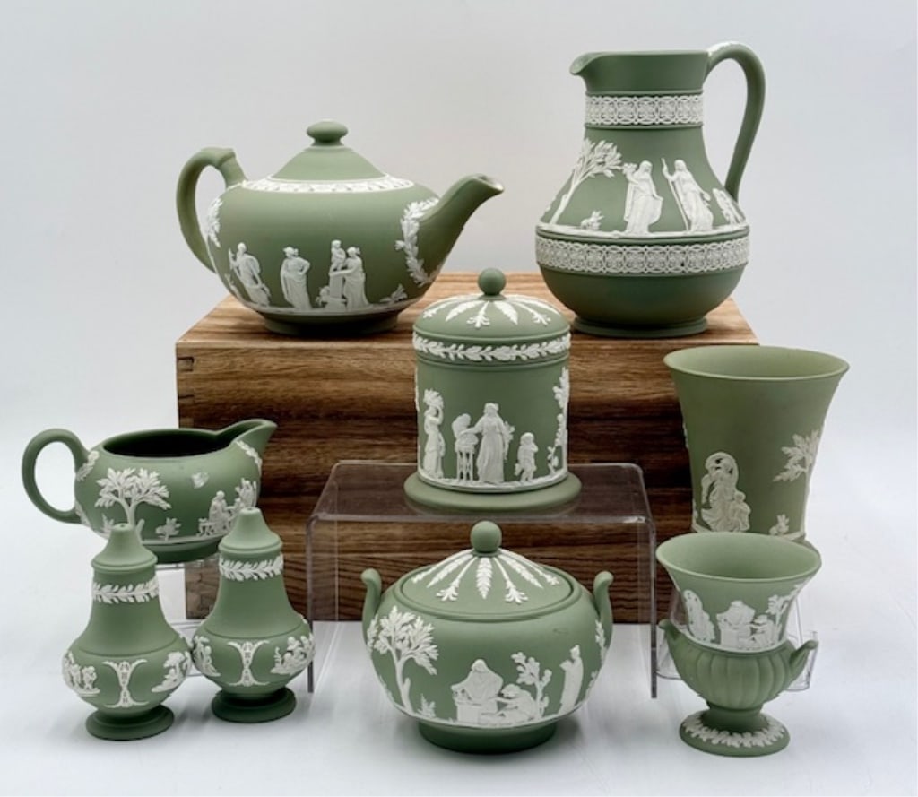 Collection of Wedgwood Green Jasperware: Collection of Wedgwood green jasperware. Includes 6" pitcher, 4" lidded tea pot, 4.25" lidded sugar dish, 2.5" creamer, 4" salt and pepper shakers, 4" lidded trinket cup (has been repaired), 4" vase, 