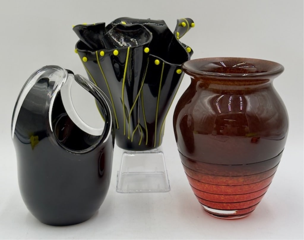 3pc Modern Art Glass Vases: 3pc Modern art glass vases. Includes 7" black and yellow handkerchief vase, 7.5" black mcm lava art vase, & 7.5" Czech Bohemian orange brown spatter vase. Photos are considered part of the condition a