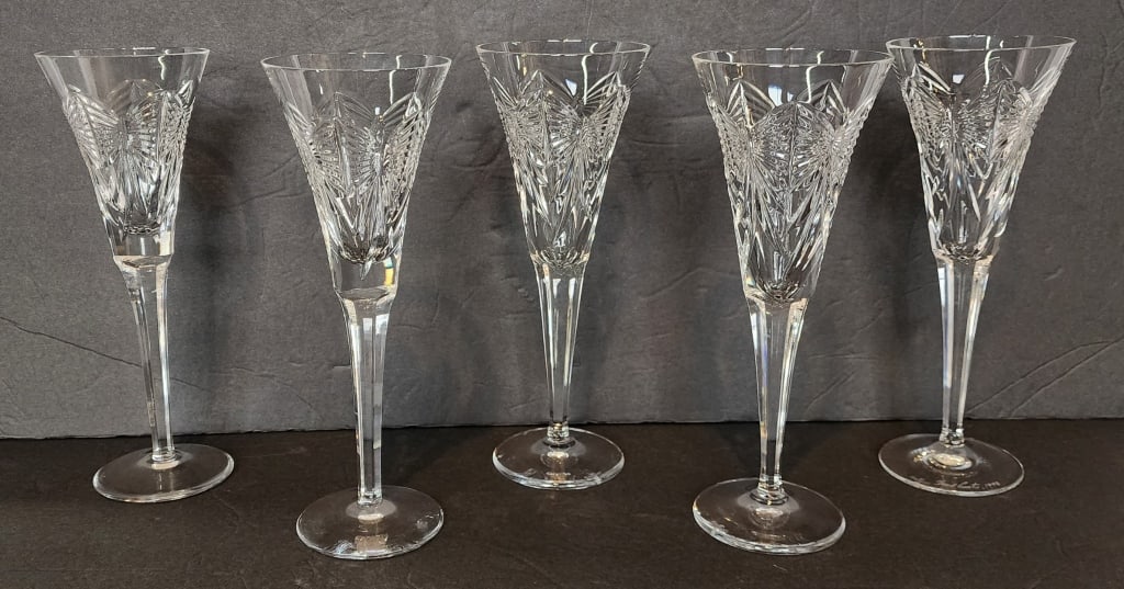 5 Waterford Crystal Millennium Happiness Flutes: 5 Waterford Crystal Millennium Happiness champagne toasting flutes. Flea bite on the rim of one. Approximately 9.25"h. Photos are considered part of the condition and description. 603-4