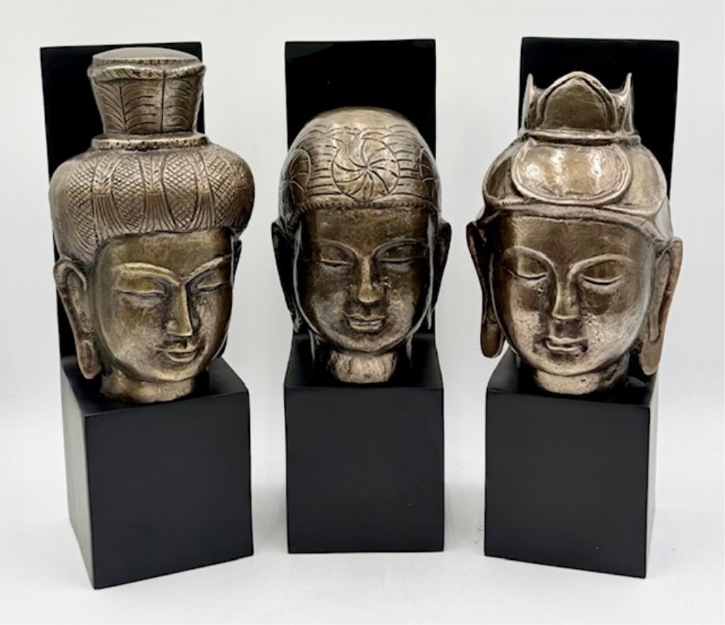 3pc Bombay Co. Metal Buddhist Busts Wall Hangings: 3pc Bombay Co. metal Buddhist busts wall hangings. Busts possibly brass or bronze. On powdered coated aluminum bases. One has paint spot present. Felt lined bottoms. Approximately 14.5"h x 4.5" square