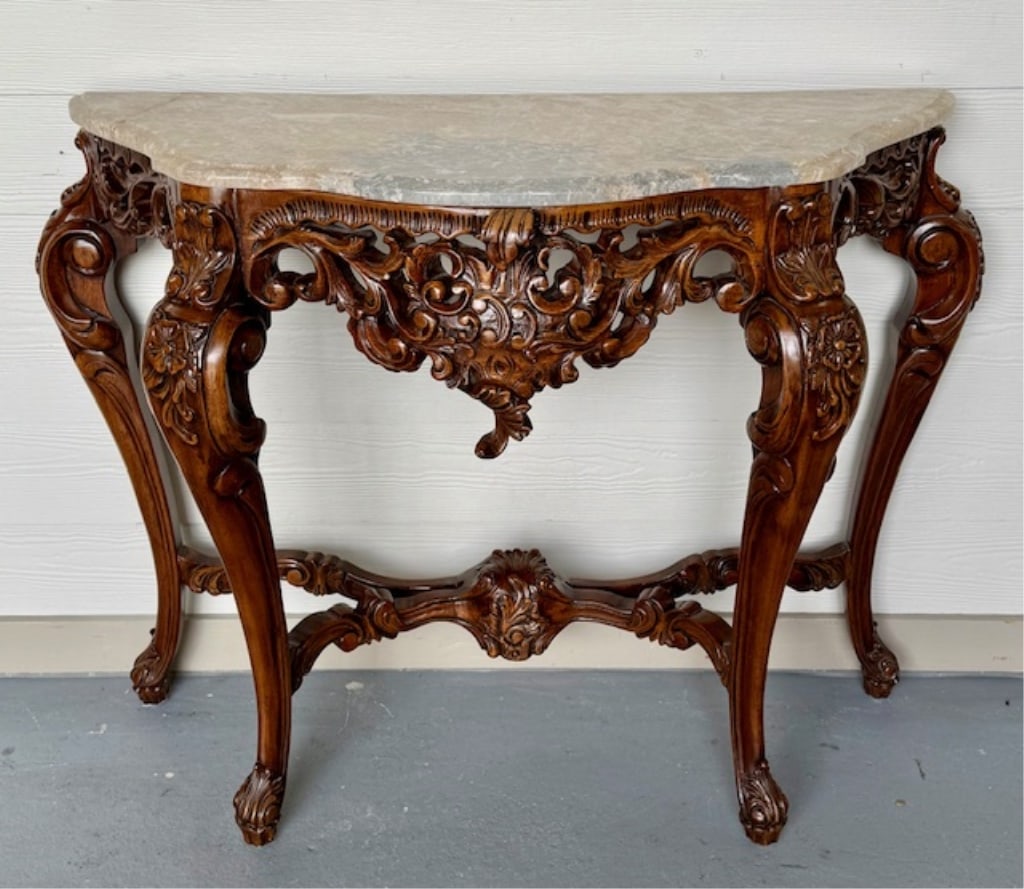 Italian Rococo Style Marble Top Console: Italian Rococo style marble top console. Beautifully carved wood base with floral accents. Removable marble top. Top has been repaired, as seen in photos. Approximately 34"h x 42"w x 17"d. Photos are