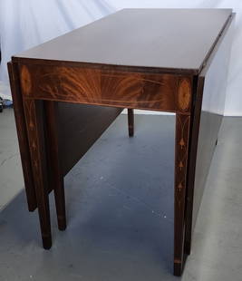 American Federal Inlaid Drop Leaf Dining Table: Vintage American Federal mahogany drop leaf table. Featuring inlaid legs and trim. Minor scratches present. Two 22" wide drop sides. Approximately 30.5"h x 23"w x 47"d. Photos are considered part of t