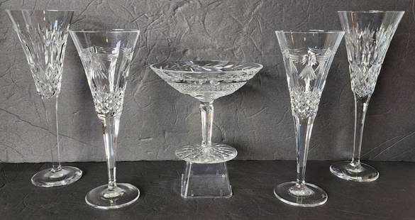 Beautiful 5pc Waterford Crystal Collection: Beautiful 5pc Waterford crystal collection. Includes 5.25"h x 6.5"w Glandore footed compote bowl, pair 9.25"h Millennium Peace champagne glasses, and pair of 10.25" Lismore champagne glasses. Excellen