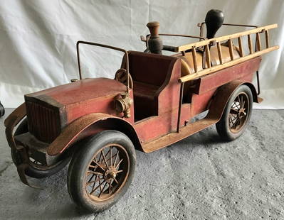 Vintage 1930's Leonardo Luna Style Fire Truck: 1930's Leonardo Luna style fire truck. Comprised of wood and metal. Missing one side ladder and firemen. Bumper loose on front. In good aged condition. Approximately 13.5"h x 29"l x 9"w. Photos