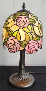 Beautiful Small Tiffany Style Stained Glass Lamp: Beautiful small Tiffany style stained glass table lamp. Floral rose shade. In working condition. Approximately 17.5"h x 8.25"w. Photos are considered part of the condition and description. 814-27