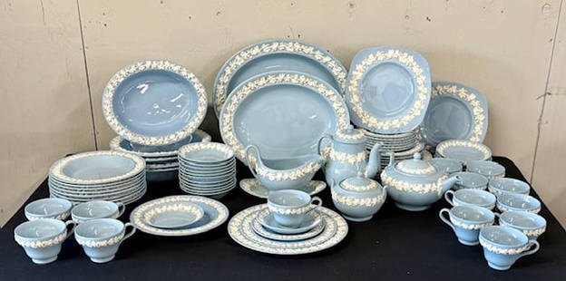 Large Wedgwood Blue Embossed Queensware Dinnerware Set: Large Wedgwood blue embossed Queensware dinnerware collection. Complete service for 6 plus many additional pieces. Total of 85 pieces. Includes (7)6" plates, (12) 8.25" plates, (10) 10" plates, (10) 8