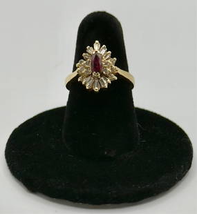 14K Ruby & Diamond Cluster Ring - 4.79g TW: 14K Ruby and diamond cluster ring. Center ruby surrounded by diamond accents. Approximately 4.79g TW. Size 6.5. Ruby has some small chips. Photos are considered part of the condition and